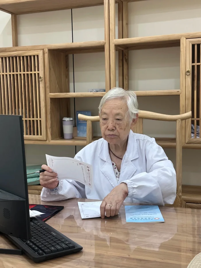 Senior female TCM practitioner